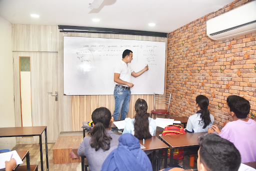 Image showcasing a teacher taking a class.
